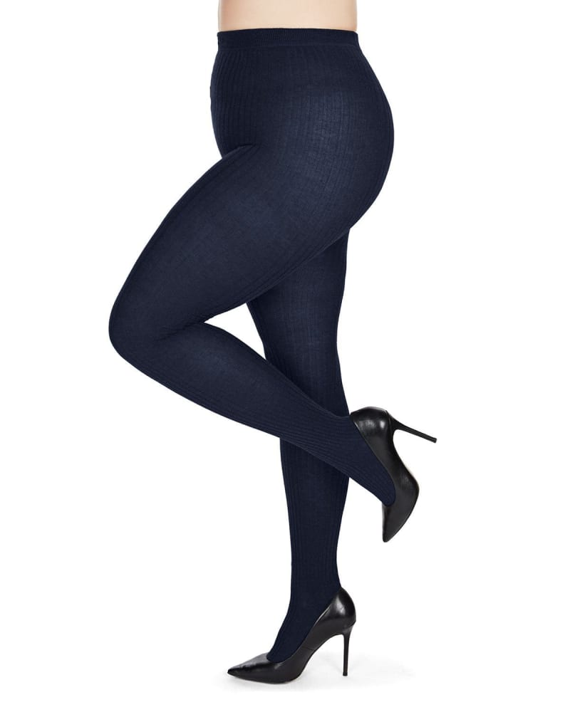 Side of a model wearing a size Q1-2 Boston Ribbed Cotton Blend Sweater Tights in Navy by Memoi. | dia_product_style_image_id:299583